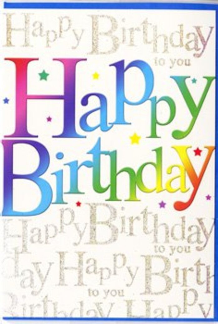 A richly designed birthday card stands centered in this photograph, its look as thoughtfully layered as a hand-crafted bouquet prepared in Brockley. The phrase Happy Birthday dominates the composition, spelled out in bold, generously spaced letters that curve gently at the edges, giving them an inviting, friendly feel. Each letter is a miniature rainbow in itself, filled with a smoothly blended wash of colour that moves from intense berry red into warm pink, cool violets, deep blues, lagoon greens, and glowing yellow, before softening into apricot and light coral. This fluid transition of tones echoes the way colours mingle in murals and street art scattered around Brockley and nearby Crofton Park. Behind the central words, the background is entirely covered in small, looping handwriting, printed in a metallic gold that appears both delicate and luminous. The script repeats Happy Birthday to you in line after line, overlapping slightly so it forms a shimmering field of wishes, like a chorus of voices blended into a gentle hum at a birthday gathering. Light seems to skim across the gold, picking out certain loops and curls with a more intense glint, suggesting movement as the card is passed from hand to hand. The main rainbow lettering sits crisp and clear above this decorative layer, ensuring easy readability while still allowing the intricate script to act as an elegant backdrop. The cardstock appears smooth and slightly glossy, with the coloured letters perhaps having a silkier, more opaque finish that stands out to the touch. The overall impression is exuberant yet tasteful, the sort of card a Brockley neighbour might choose to accompany seasonal flowers being delivered to a friend's home near Telegraph Hill, turning a simple birthday message into a burst of colour and shimmering sentiment.